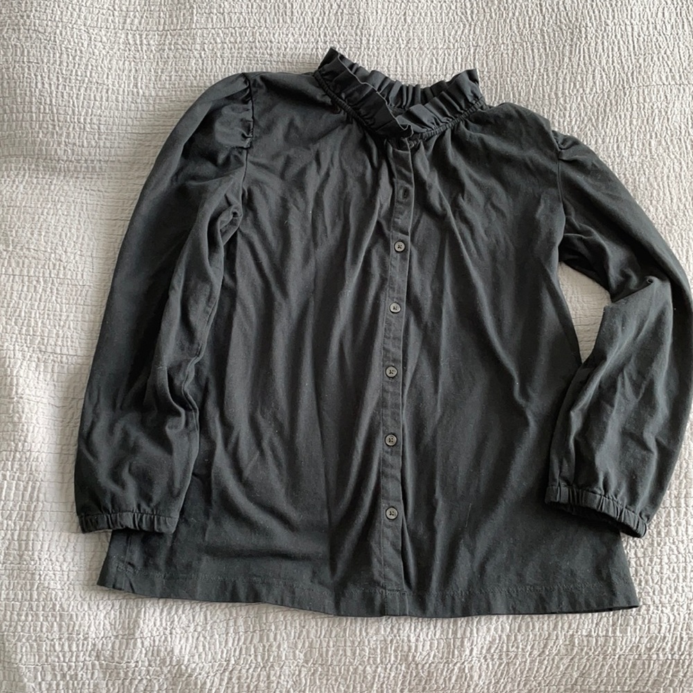 Cotton shirt and stretchy a little bit.